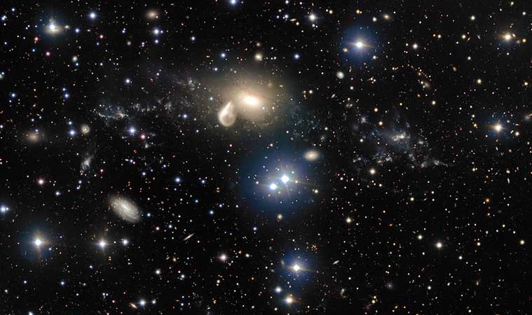 The spectacular aftermath of a 360 million year old cosmic collision is revealed in great detail in this image from ESO’s Very Large Telescope at the Paranal Observatory. Among the debris surrounding the elliptical galaxy NGC 5291 at the centre is a rare and mysterious young dwarf galaxy, which appears as a bright clump towards the right of the image. This object is providing astronomers with an excellent opportunity to learn more about similar galaxies that are expected to be common in the early Universe, but are normally too faint and distant to be observed by current telescopes.