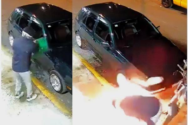 Quemado. En el video sujeto embozado rocía un coche que estaba estacionado en la calle Av. Islas, colonia Atlanta. Al prender fuego, se incendia también
